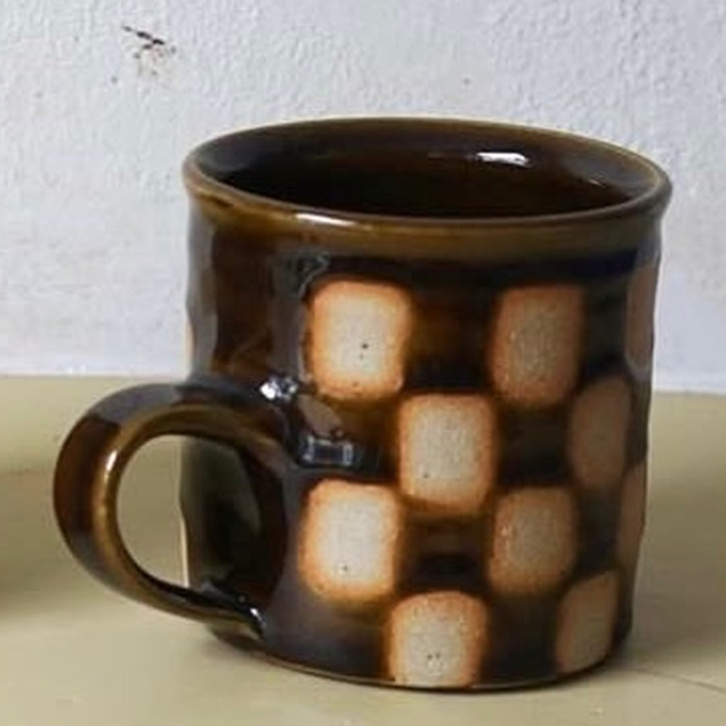 Edmund Davies checkerboard mug in brown glaze