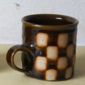 Edmund Davies checkerboard mug in brown glaze