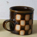 Edmund Davies checkerboard mug in brown glaze