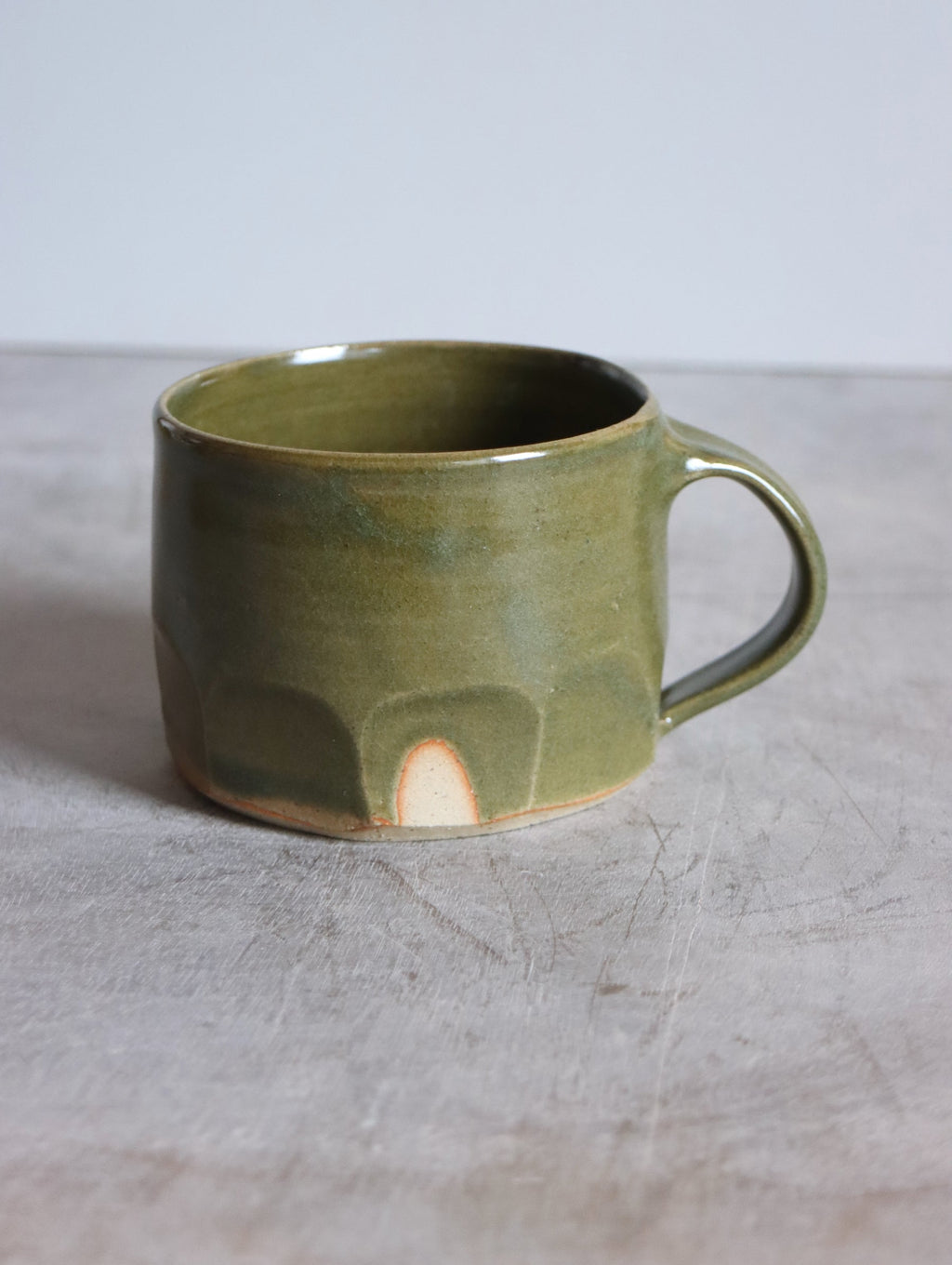 Moss green faceted mug by Hannah Burgess Ceramics, view 1