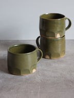 Moss green faceted mug by Hannah Burgess Ceramics, view 2