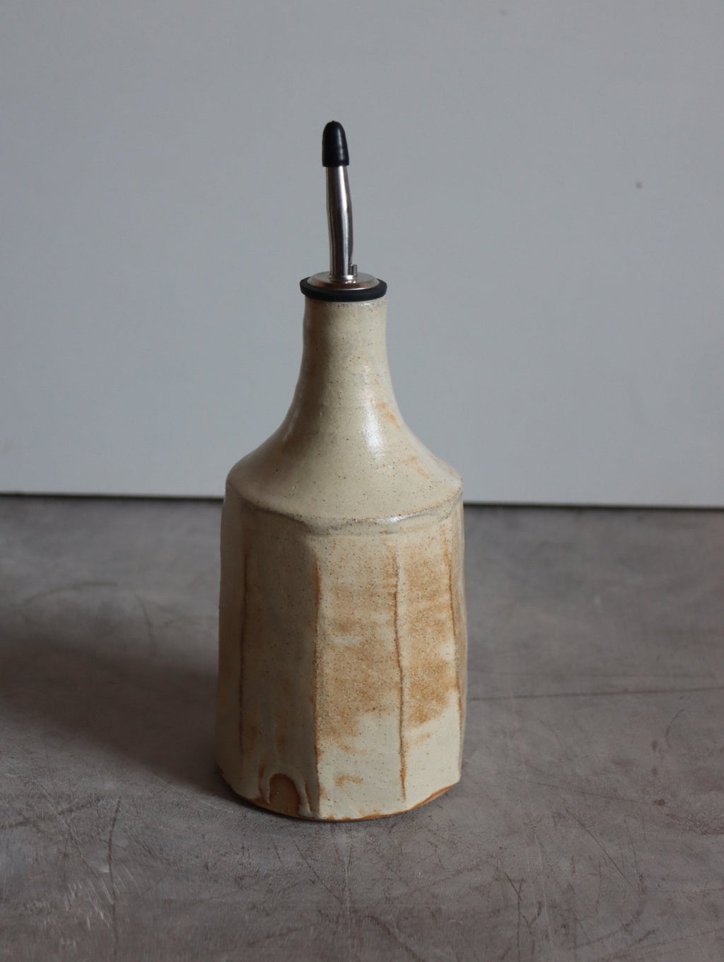 Iron-rich white faceted oil pourer by Hannah Burgess Ceramics, third view