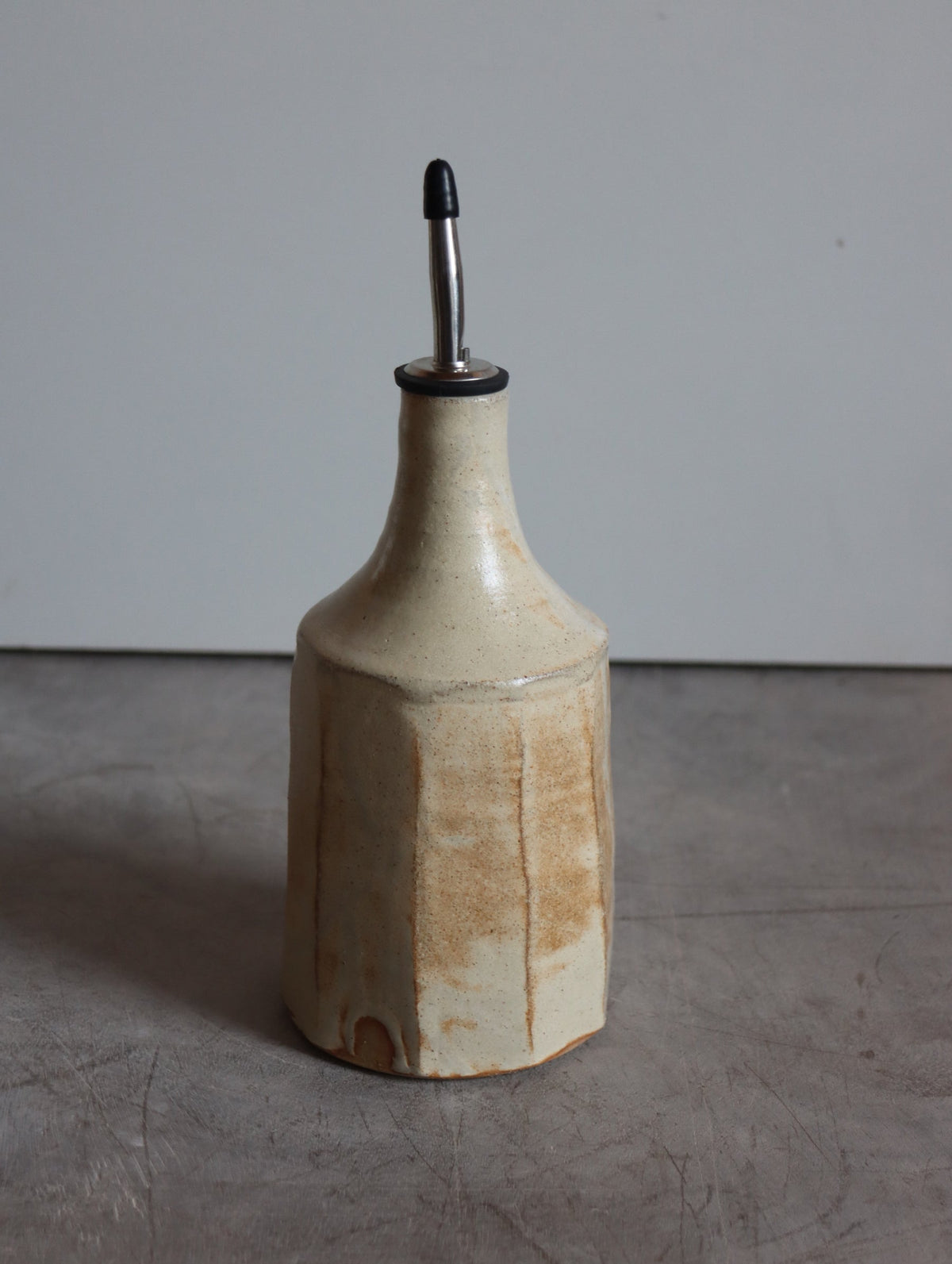 Iron-rich white faceted oil pourer by Hannah Burgess Ceramics, third view